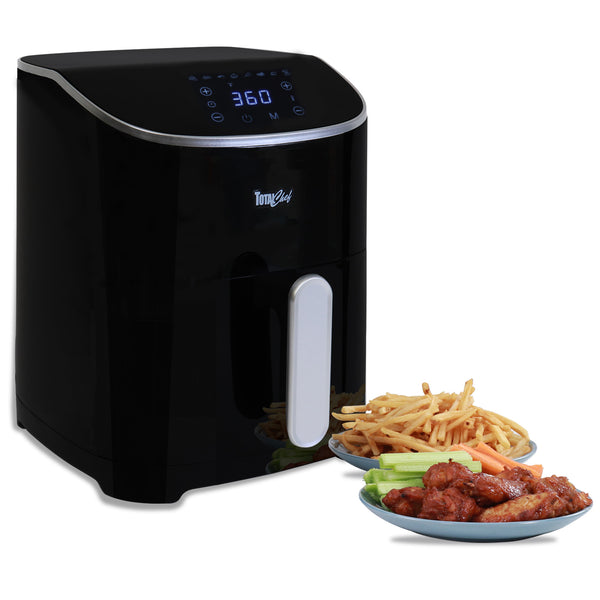 Total Chef air fryer with plates of cooked chicken wings and french fries beside it on a white background.