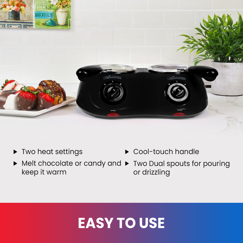 Lifestyle image of chocolate fondue pot on a white counter with a plate of chocolate-dipped strawberries and marshmallows on the left and a plant in a white pot on the right. Text below reads, "Easy to use: Two heat settings; Melt chocolate and keep it warm; Cool-touch handle; Two dual spouts for pouring or drizzling"